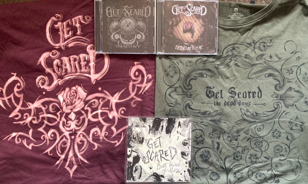 Get Scared merch including cds and handmade shirts.